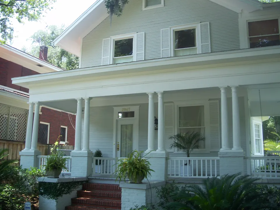A residential street in the Riverside Historic District of Jacksonville, Duval County, with older houses set back behind mature trees.