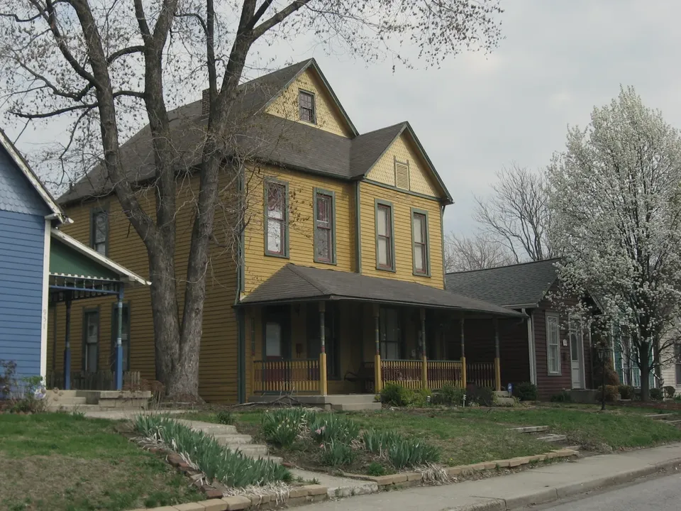 The exterior of an older house showing weathered siding and an ageing roof, in ordinary condition
